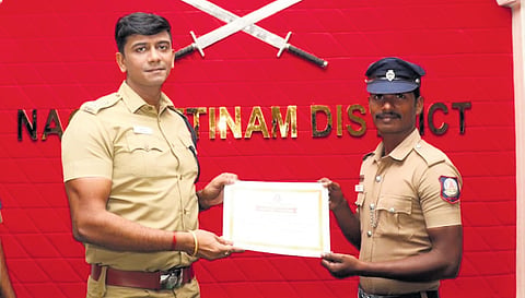 SP Harsh Singh hands over certificate of appreciation to Nelson. 