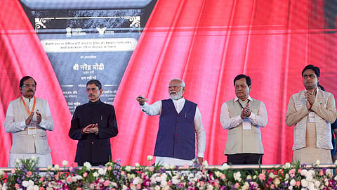Prime Minister Narendra Modi with Tamil Nadu Governor R.N. Ravi and Union Minister Sarbananda Sonowal during the inauguration and foundation stone laying ceremony of various developmental projects, in Thoothukudi