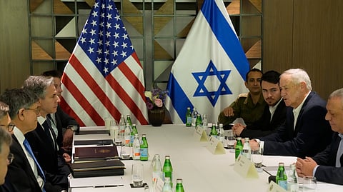 U.S. Secretary of State Antony Blinken meets with former Israel Defense Forces (IDF) chief Gadi Eisenkot, right, and former Israeli Defense Minister Benny Gantz in Tel Aviv, Israel. 