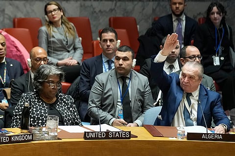 Algerian Ambassador to the United Nations Amar Bendjama, right, votes to approve a resolution concerning a ceasefire in Gaza while Linda Thomas-Greenfield, United States Ambassador to the U.N., left, looks on during a Security Council meeting at United Nations headquarters, Tuesday, Feb. 20, 2024. 