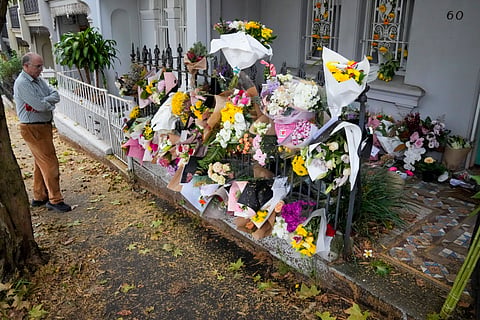 A man stands outside the Paddington residence of Jesse Baird in Sydney.