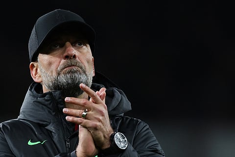 Liverpool manager Jurgen Klopp applauds at the end of the English Premier League football match between Arsenal and Liverpool at the Emirates Stadium in London on February 4, 2024.