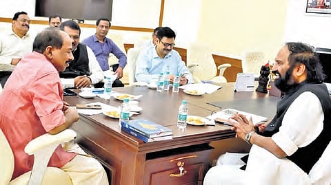 Civil Supplies Minister N Uttam Kumar Reddy speaks to his counterpart from Kerala 
GR Anil at his office in the Secretariat on Friday