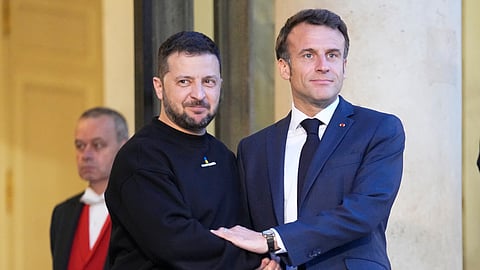 FILE - French President Emmanuel Macron, right, welcomes Ukrainian President Volodymyr Zelenskyy at the Elysee palace in Paris, May 14, 2023. 