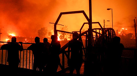 Wildfires blazing across Chile have killed at least 51 people, leaving bodies in the street and homes gutted, with flames continuing to spread on Sunday and the toll expected to rise.