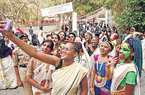Students of Government College for Women, hailing from African countries and dressed in traditional attire, posing with local students during the procession preceding the inauguration of Kerala University Youth Festival in capital on Thursday 