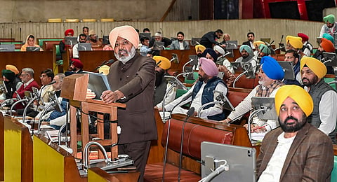 Punjab Finance Minister Harpal Cheema presents the State Budget 2024-25 in the Assembly, in Chandigarh, Tuesday, March 5, 2024. Chief Minister Bhagwant Mann is also seen. 