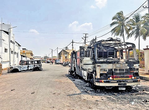 The charred remains of the vehicles targetted by protesters in Byadgi on Monday