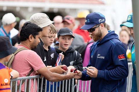 New Zealand's Kane Williamson signs autographs for fans on day four of the 1st International cricket Test match between New Zealand and Australia at the Basin Reserve in Wellington on March 3, 2024. 