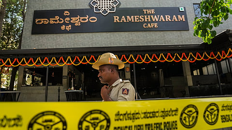 A police official stands guard at the Rameshwaram cafe blast site, in Bengaluru.