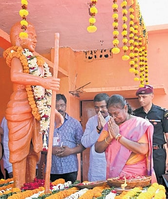President Droupadi Murmu accompanied by Union Minister Dharmendra Pradhan pay homage to Bhima Bhoi 