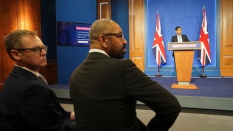 Britain's Minister of State for Countering Illegal Migration Michael Tomlinson, left, and Home Secretary James Cleverly, attend a press conference in Downing Street, London, held by Britain's Prime Minister Rishi Sunak, on Jan. 18, 2024. 