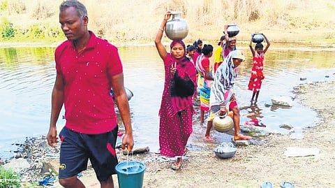 Jambani villagers collect water from a stream for their daily use 