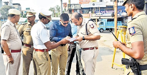 Officials from the PM’s special protection group with police personnel at Saibaba Colony Junction in Coimbatore on Saturday 