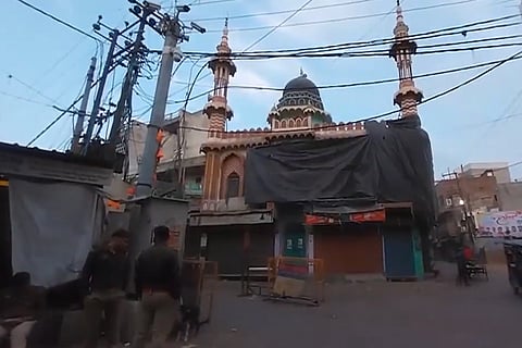 Four mosques in sensitive areas of Aligarh covered with tarpaulin by Masjid Intezamia Committee, ahead of Holi. 
