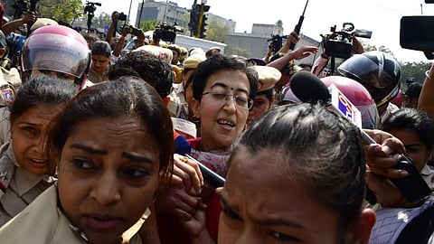 Delhi Minister Atishi with AAP workers being detained during a protest at ITO against the arrest of Chief Minister Arvind Kejriwal by the Enforcement Directorate in the money laundering case. 