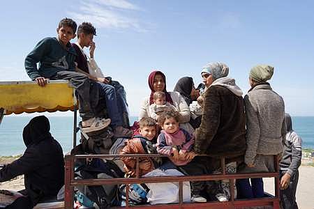 People who fled the Al-Shifa hospital and its vicinity in Gaza City are driven from the central Gaza Strip further south, on March 21, 2024. 