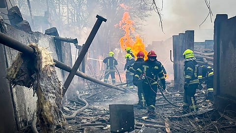 Emergency services work at the scene of a Russian attack in Odesa, Ukraine