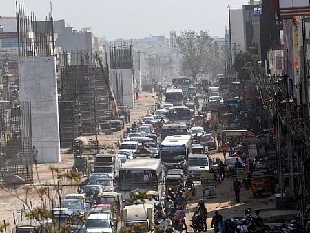 Traffic congestion near the Bathlapalli new bus stand in Hosur to Krishnagiri National Highway due to flyover construction 