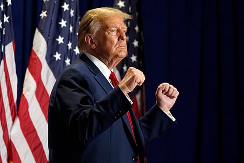  Donald Trump gestures at a campaign rally.