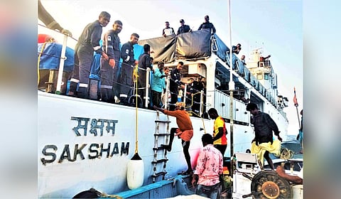 The rescued crew of the dhow boarding the Coast Guard ship 