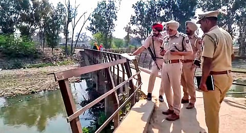 Police investigate after four persons died due to the suspected consumption of spurious liquor in Sunam, Punjab, Friday, March 22, 2024. 