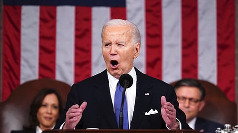 US President Joe Biden delivers the State of the Union address to a joint session of Congress at the Capitol, Thursday, March 7, 2024, in Washington. Seated at left is Vice President Kamala Harris and at right is House Speaker Mike Johnson, R-La. 