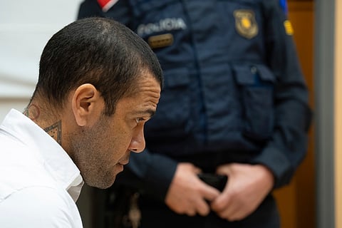 Brazilian soccer star Dani Alves sits during his trial in Barcelona, Spain, Monday, Feb. 5, 2024.