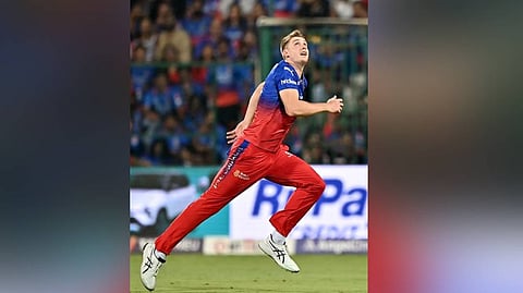 Royal Challengers Bengaluru's Cameron Green runs to field the ball during an IPL T20 match.