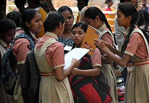 Students arrive to give their SSLC examination at a Government School, one of the centers at Kengeri Satellite Town 