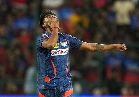 Lucknow Super Giants's Mayank Yadav celebrates after taking the wicket of RCB batter Rajat Patidar during the IPL 2024 T20 cricket match between RCB and Lucknow Super Giants on April 2, 2024. 