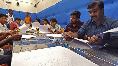 Election Commission officials proofread braille ballot sheets printed by the Kerala Federation of the Blind in Thiruvananthapuram 
