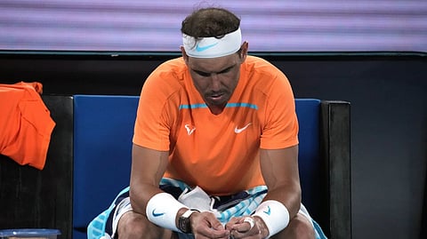 Rafael Nadal of Spain reacts during his second round loss to Mackenzie McDonald of the U.S. at the Australian Open tennis championship in Melbourne, Australia, Wednesday, Jan. 18, 2023.