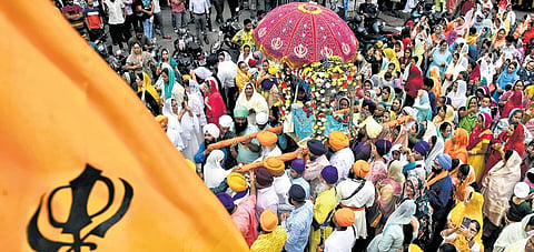 Sikh devotees take part in the Nagar Kirtan in Ameerpet, Hyderabad, on Saturday.