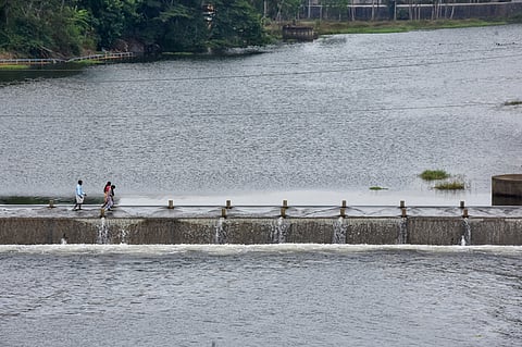 After few weeks water release from pechiparai dam, water flow in  Thamirabarani river, public walk throw the water at Kulitha