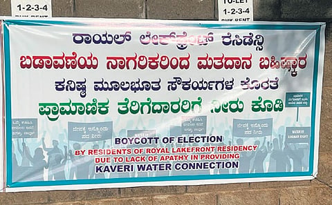 The banner put up by residents, threatening to boycott polls