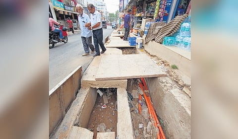 The newly constructed drain, filled with sand, has been covered with slabs at Statue-General Hospital Road in Thiruvananthapuram 