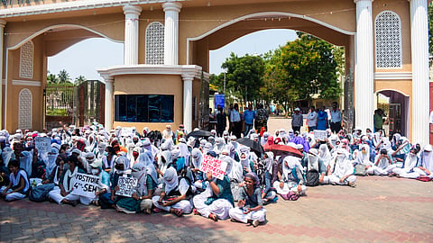 Students of Rama Devi Women's University protest demanding postponement of +3 second year exam in the view heatwave, outside University campus in Bhubaneswar on Friday. 
