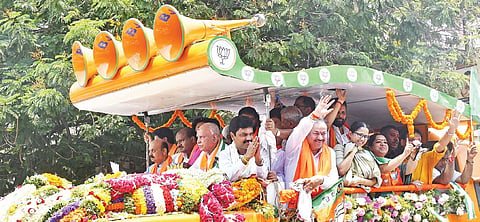 BJP Shivamogga candidate BY Raghavendra takes out a procession, accompanied by former chief ministers BS Yediyurappa, Basavaraj Bommai and HD Kumaraswamy, as part of his nomination filing, in Shivamogga on Thursday 