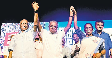 Chief Minister Pinarayi Vijayan with LDF candidates Elamaram Kareem and K K Shailaja in Kozhikode
