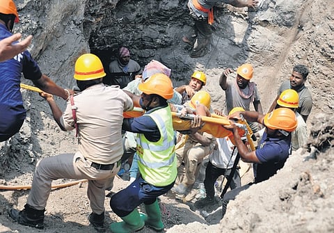 Rescue workers rescue the 15-month-old child in Vijayapura on Thursday