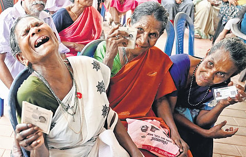 Kunki, Devi and Janu of Aduppil tribal colony at Vilangad in Kozhikode waiting to exercise their franchise outside the polling booth at Karukulam Sishu Mandir, Vanimel, on Friday.  