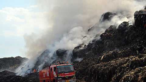 Firefighters attempt to douse the fire that broke out at the Ghazipur landfill site on April 22, in New Delhi. (Photo | Parveen Negi, EPS)    