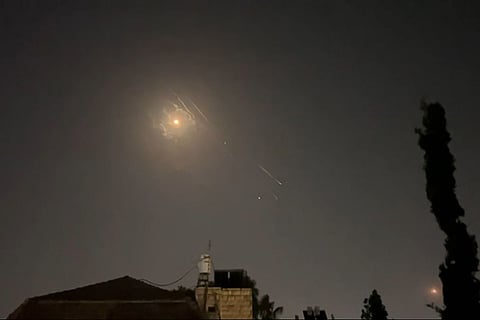 This video grab from AFPTV taken on April 14, 2024 shows explosions lighting up Jerusalem sky during Iranian attack on Israel