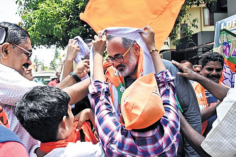 BJP workers welcome Rajeev Chandrasekhar with shawls at Aksharaveedhi Nagar 
in Pettah. 