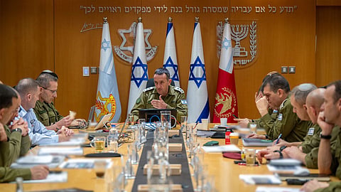 This handout picture released by the Israeli Army shows the head of the military, Lieutenant General Herzi Halevi (C), attending a situational assessment with members of the General Staff Forum at the Kirya military base, which houses the Defence Ministry in Tel Aviv.