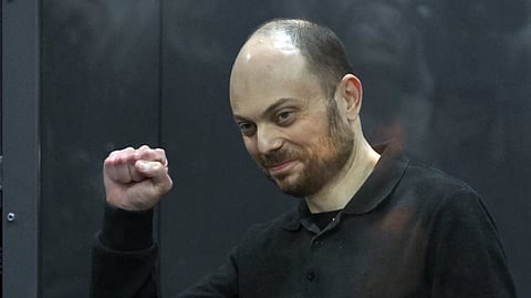 Russian opposition activist Vladimir Kara-Murza gestures standing in a glass cage in a courtroom during announcement of the verdict on appeal at the Moscow City Court in Moscow, Russia, on July 31, 2023.