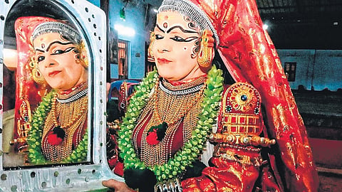 Kathakali artist C S Devayani takes a look at her attire before performing as Lalitha  in ‘Poothanamoksham’ in Mavelikkara on Sunday 