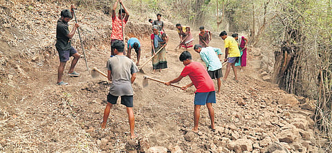 Tribals making a pathway on their own to the hilltop village, Pedagaruvu, en route to the neighboring hilltop hamlet of Jajulabanda in Alluri Sitarama Raju district.