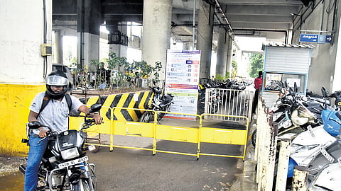 Two-wheeler riders say they are sometimes forced to wait from 30 minutes to two hours in queue to get a parking slot during rush hours.